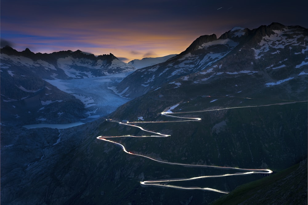 snow covered mountains and road