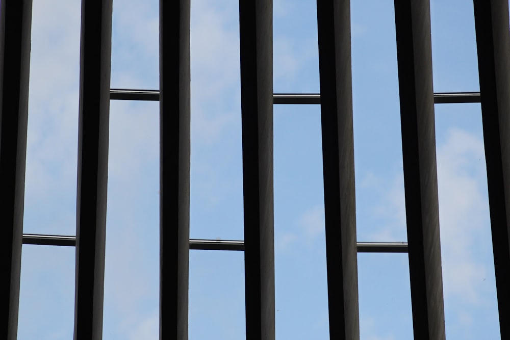 a view of the sky through the bars of a window