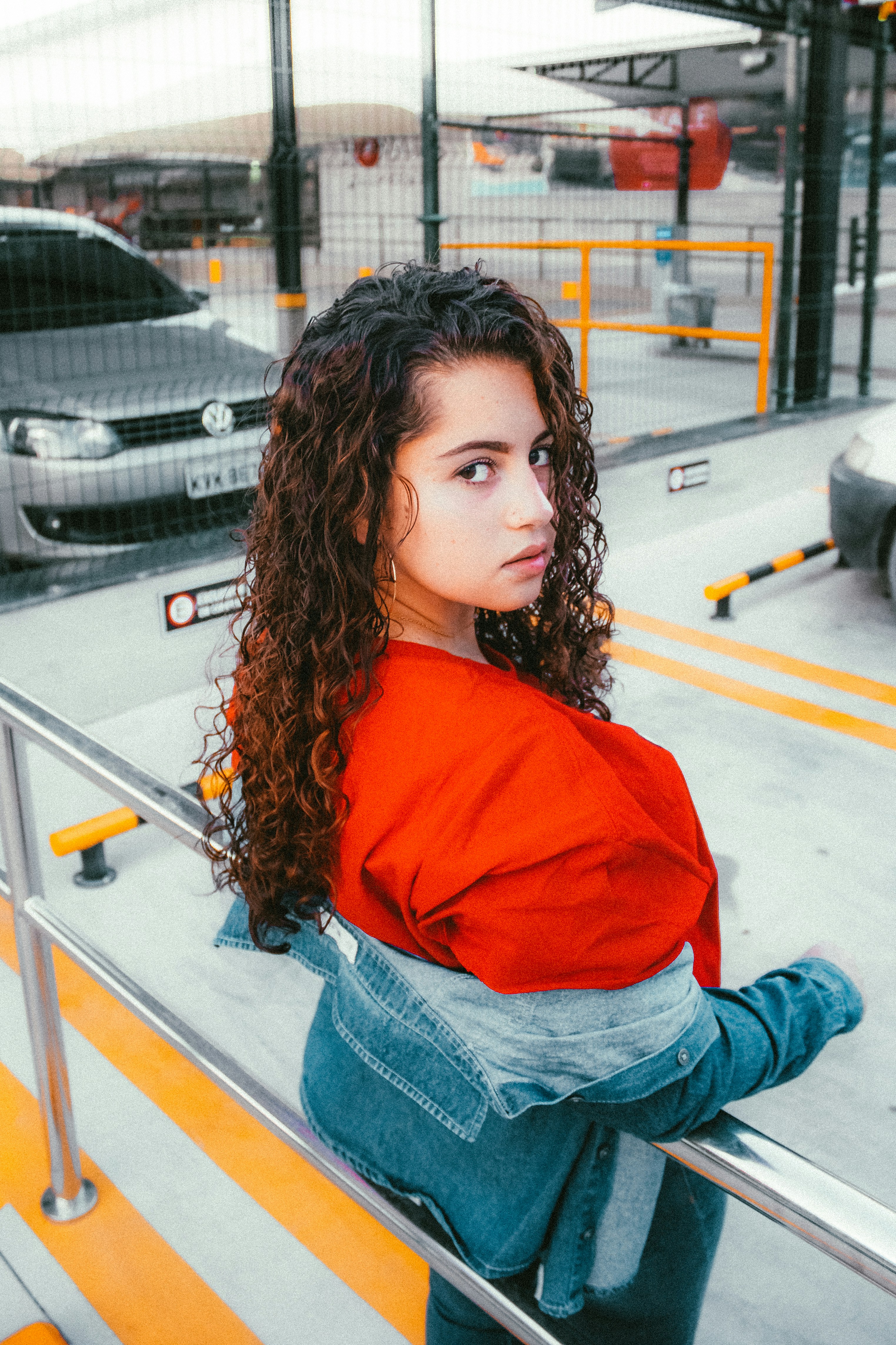 orange shirt and blue jeans