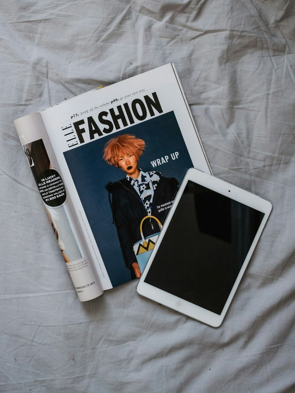 white iPad on magazine