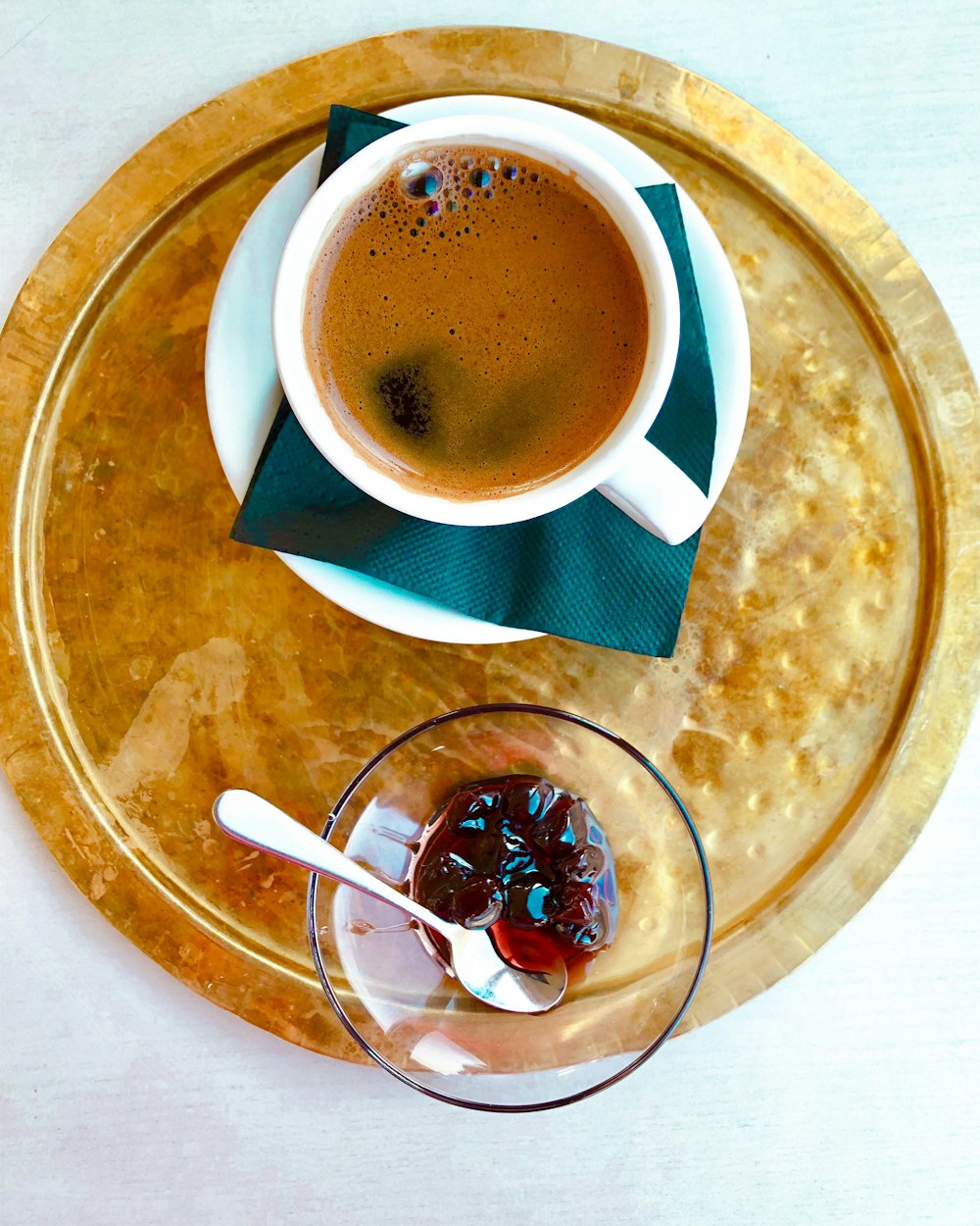 white ceramic cup and clear glass bowl