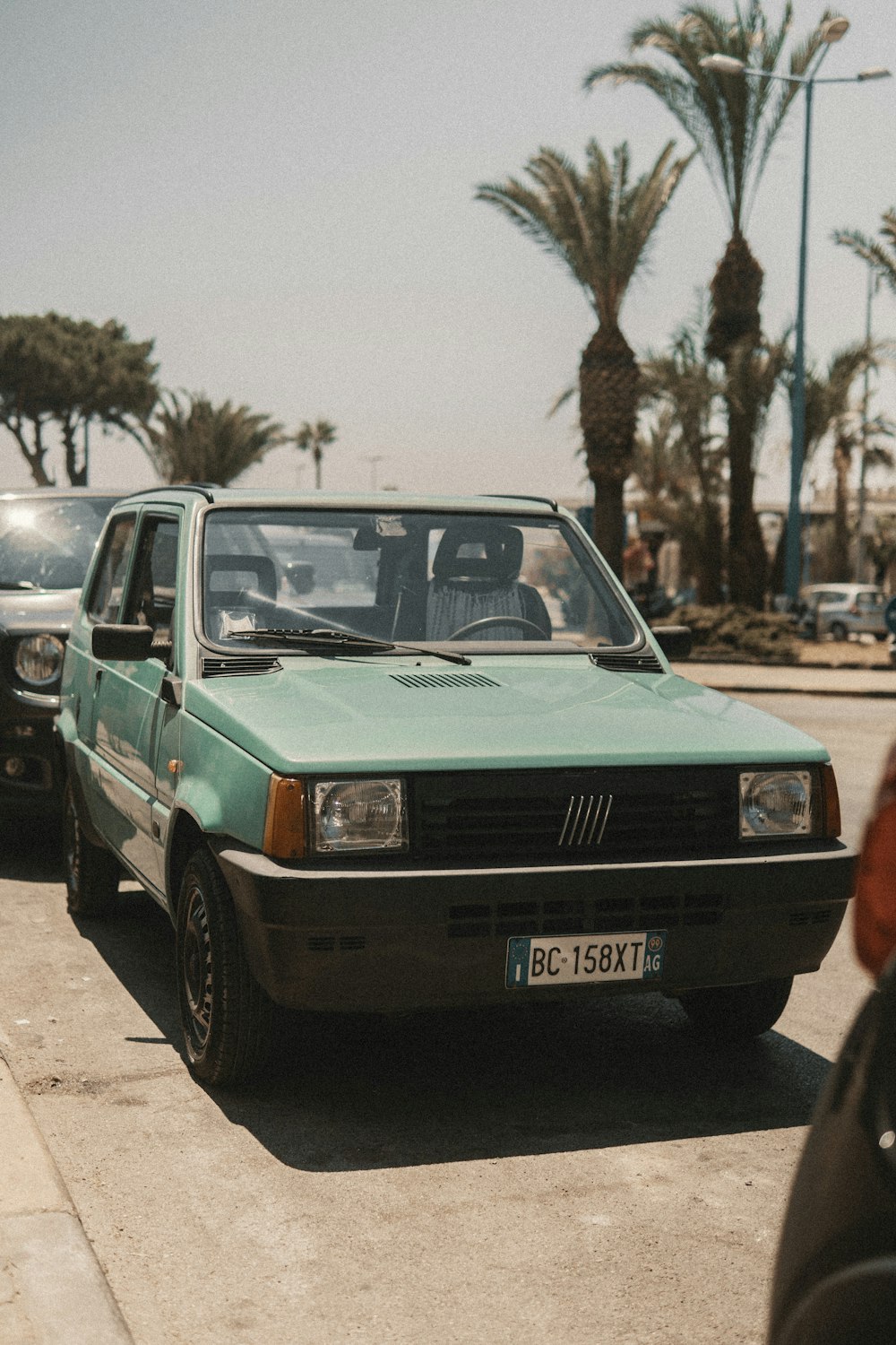 teal FIAT vehicle