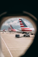 Fleet of cargavoa airplanes lined up on the tarmac ready for departure.