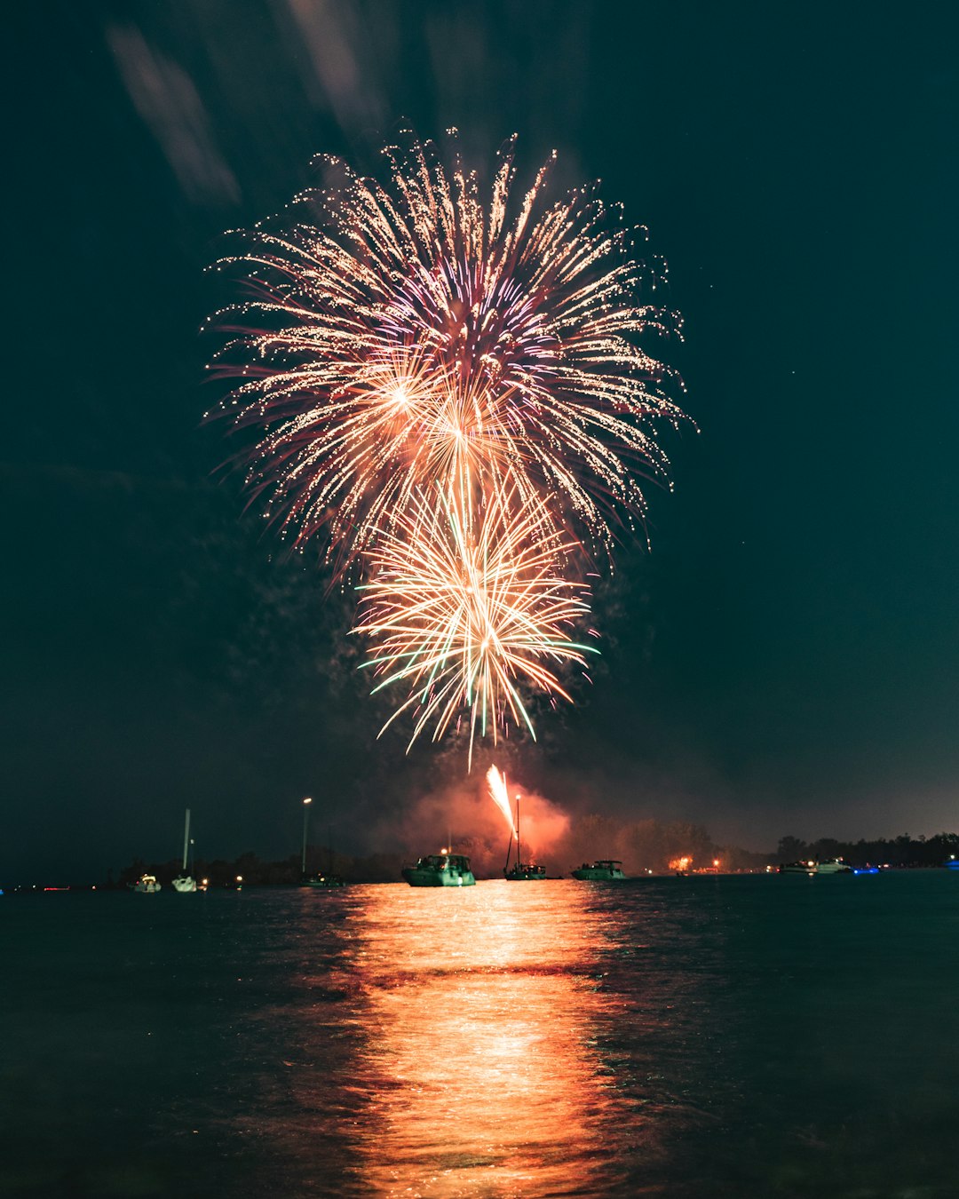 fireworks display at the harbor during nighttime