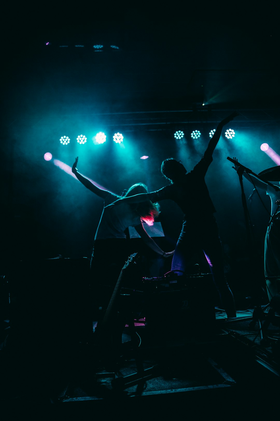 two people on a stage performing