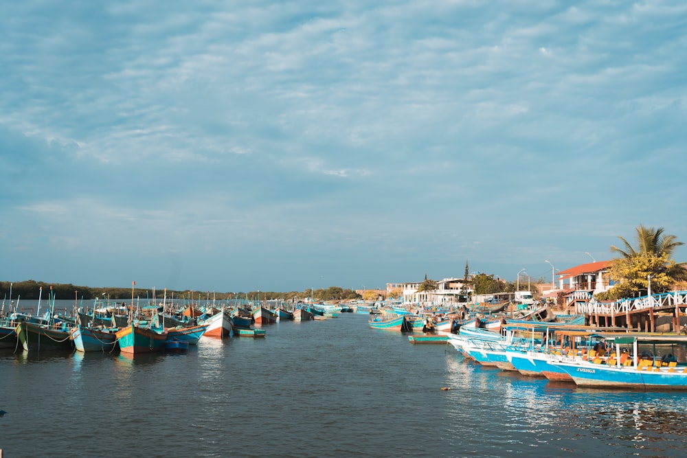 blue rowboat on sea port