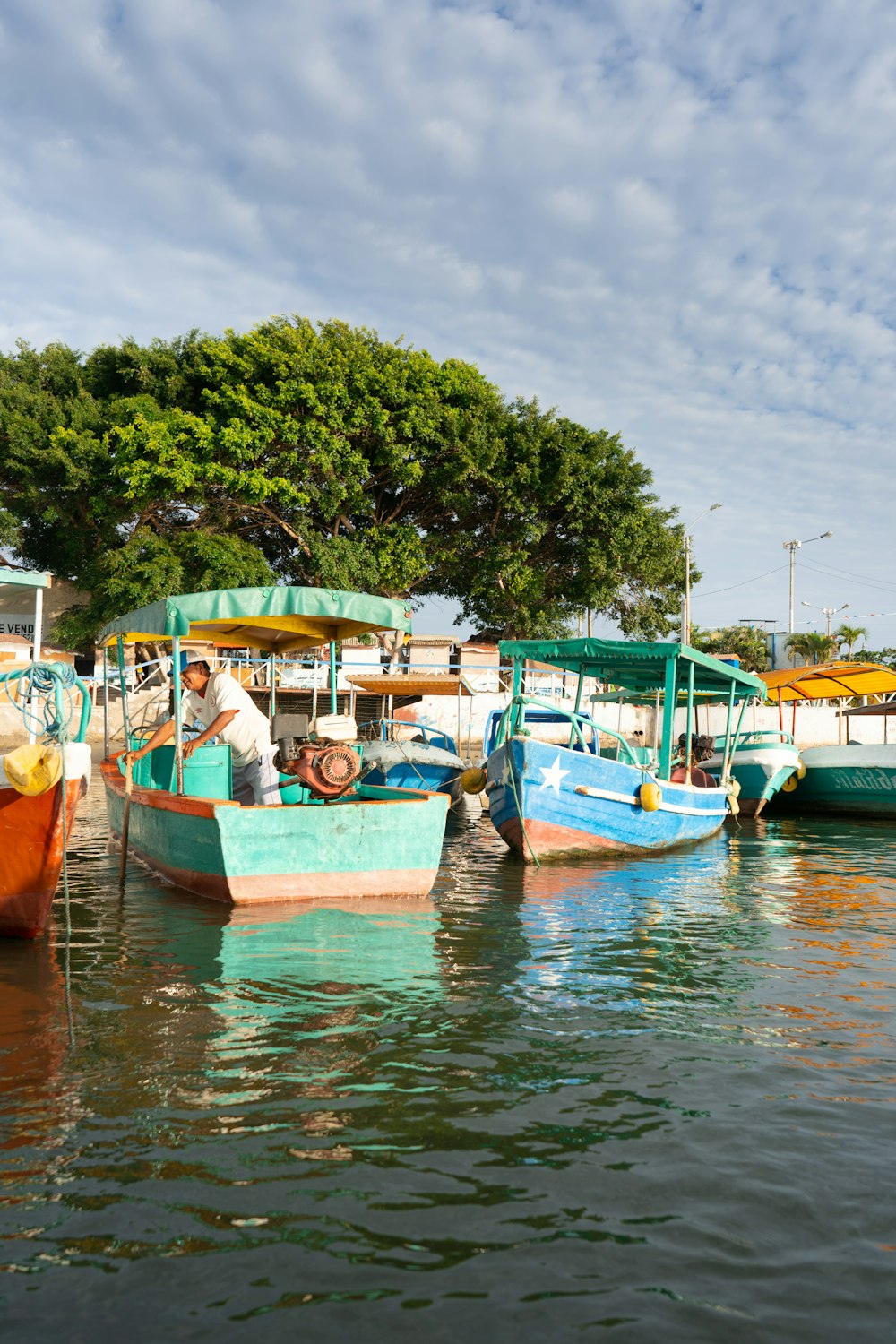 person riding on green and brown boat during daytime