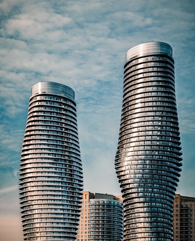 two gray high-rise buildings
