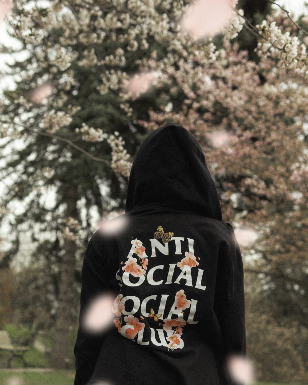 person wearing black and white Anti Social Club jacket