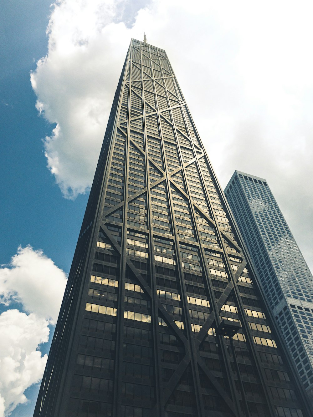 low-angle photography of building under clear blue sky