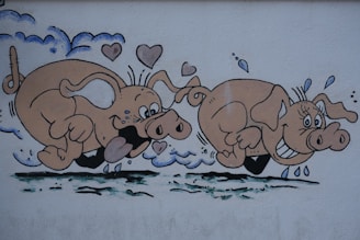 A playful cartoon mural of two pink pigs running with joyful expressions on their faces. The pigs have exaggerated features, such as large ears and wide smiles. Hearts and water droplets are around them, giving a sense of fun and movement.
