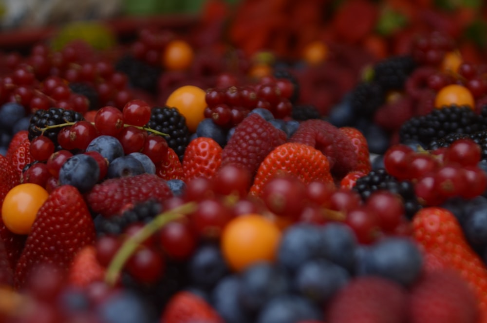 bunch of raspberry and grapes