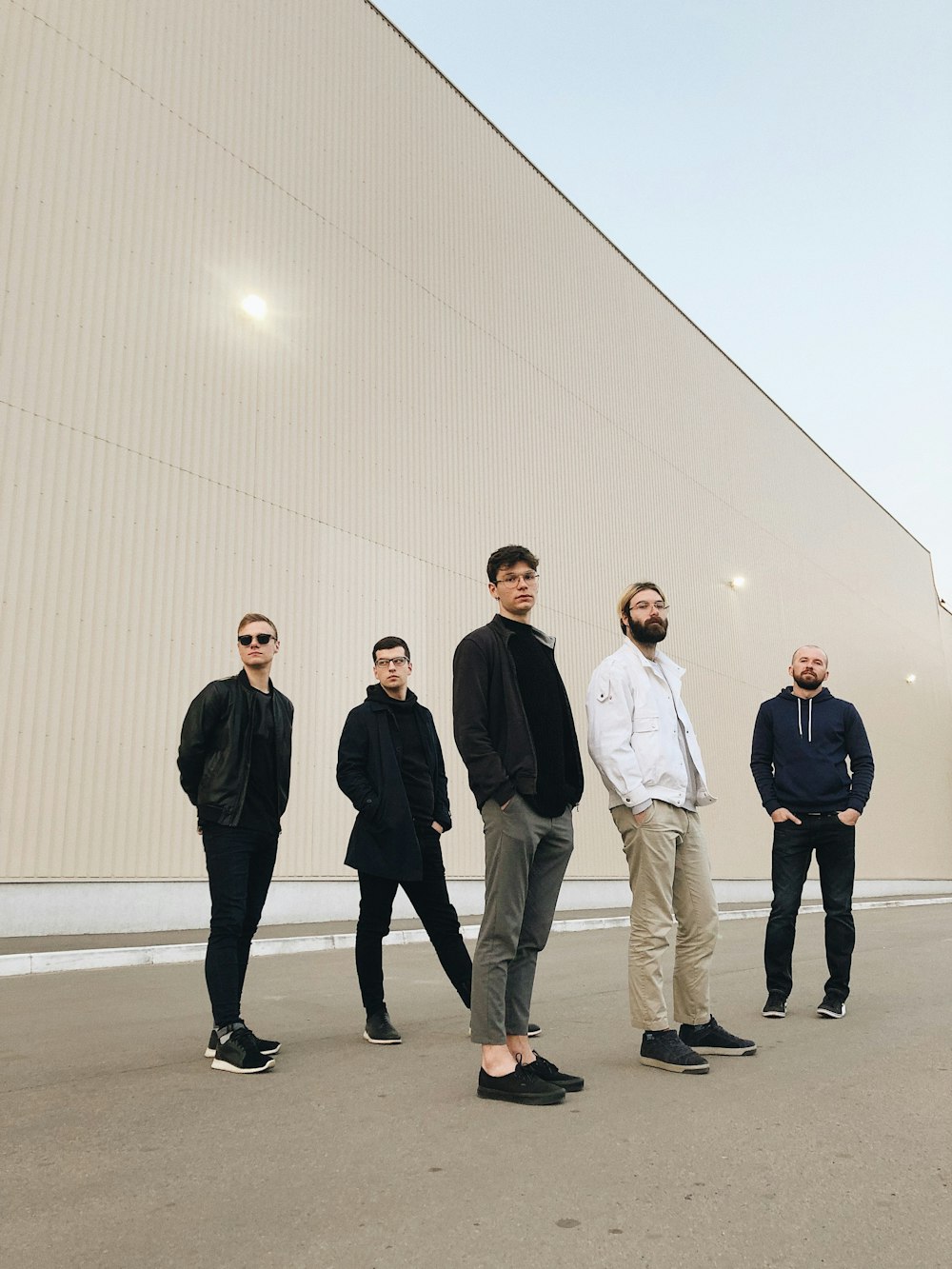 five men wearing formal attires