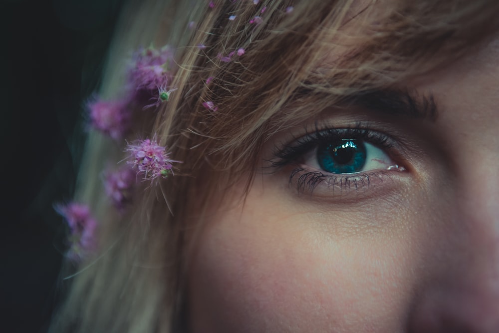 a close up of a person with blue eyes