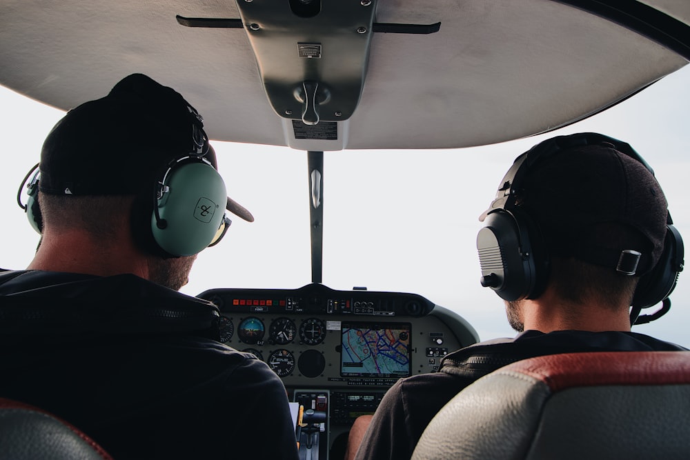 two pilots manuevering the plane