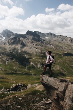 man standing on cliff