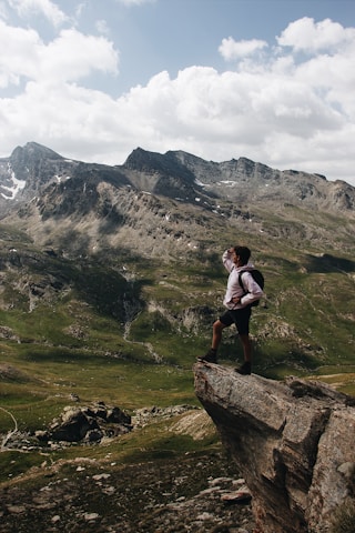 man standing on cliff