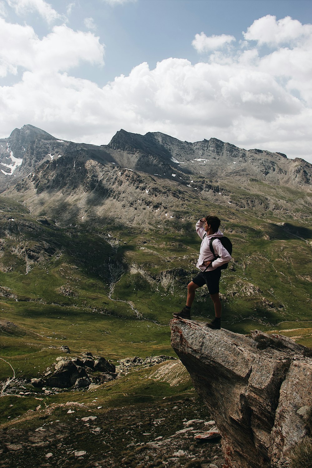 man standing on cliff