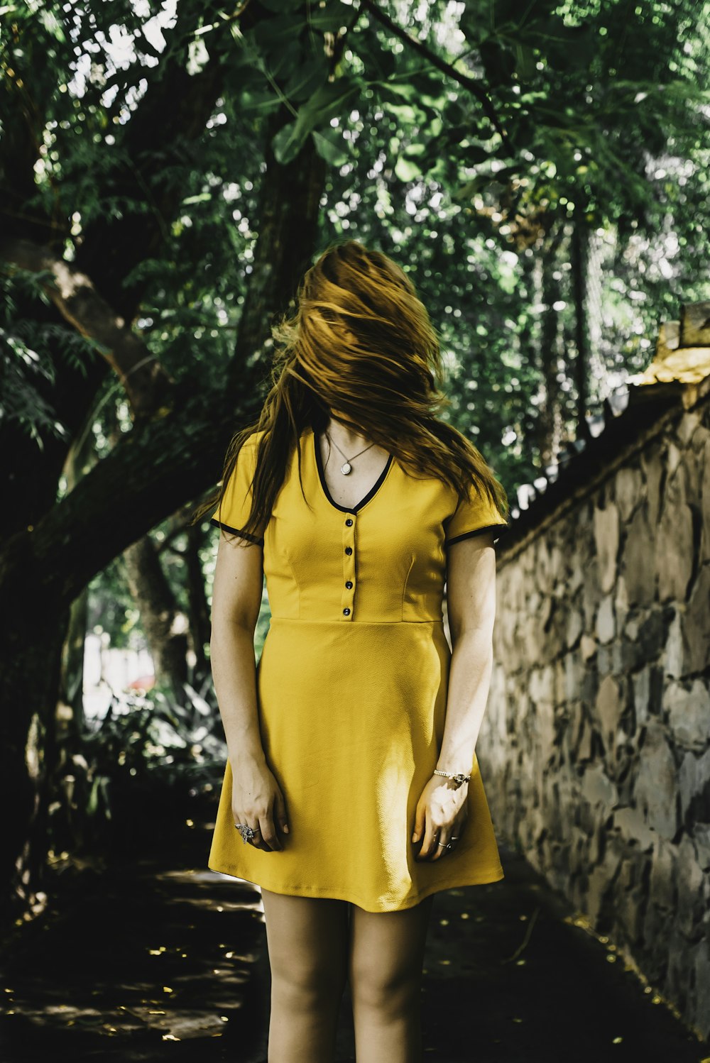 woman standing beside wall