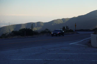 A scenic highway with a protected vehicle driving smoothly to show comprehensive care.