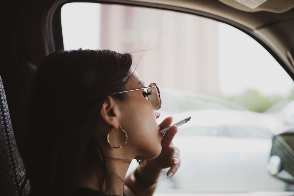 woman sitting inside vehicle