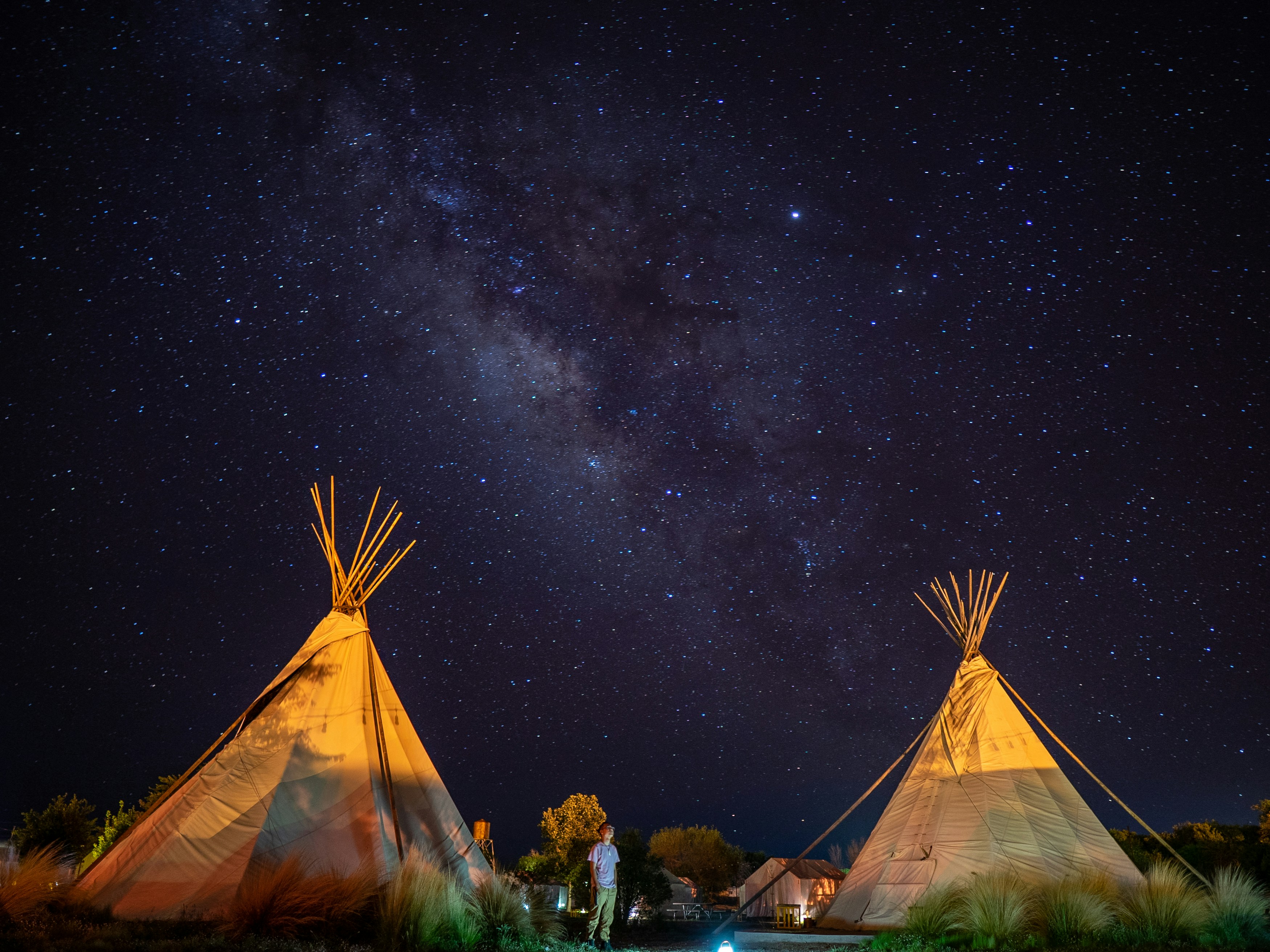 two brown tiki tents