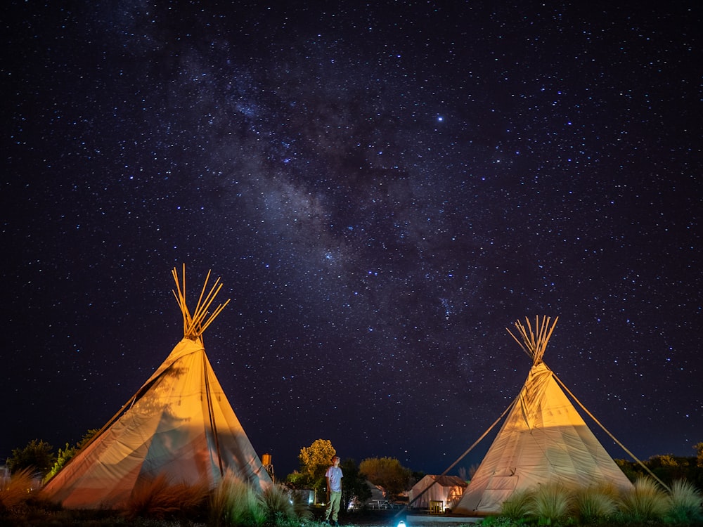 two brown tiki tents