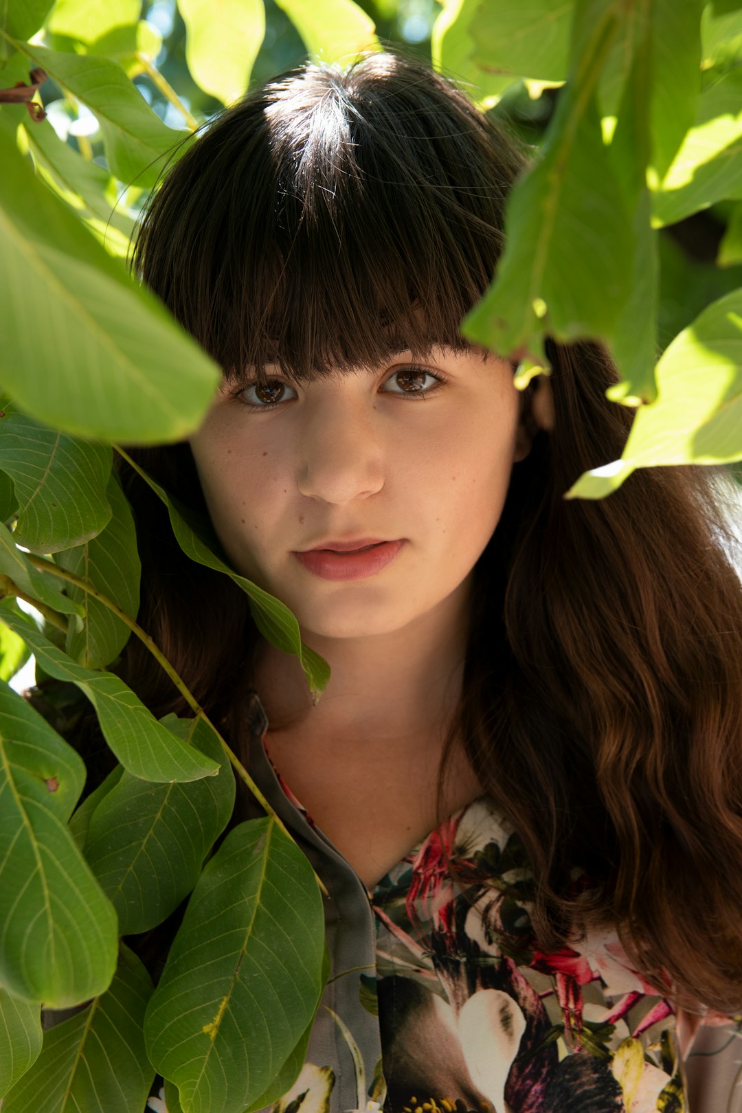 woman standing beside tree