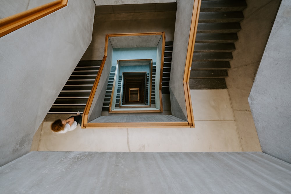 person standing black and white stairs