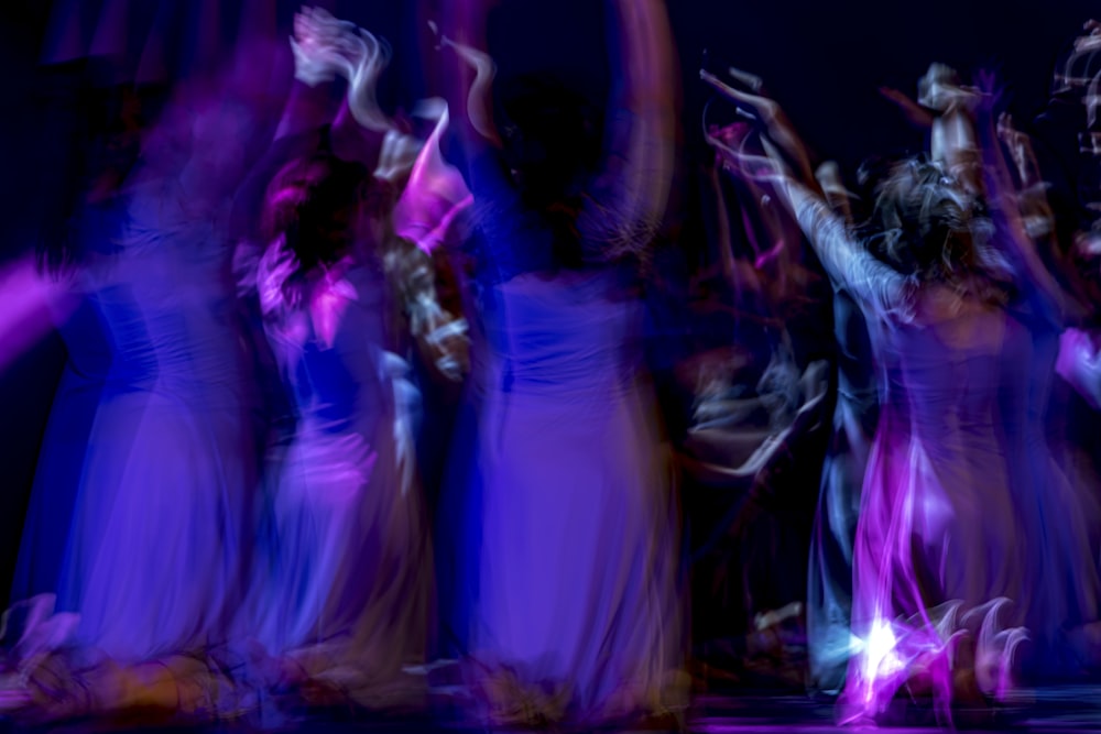 a group of people dancing on a stage