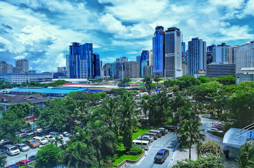 A bustling Los Angeles cityscape with highrise buildings and business professionals discussing plans over charts.