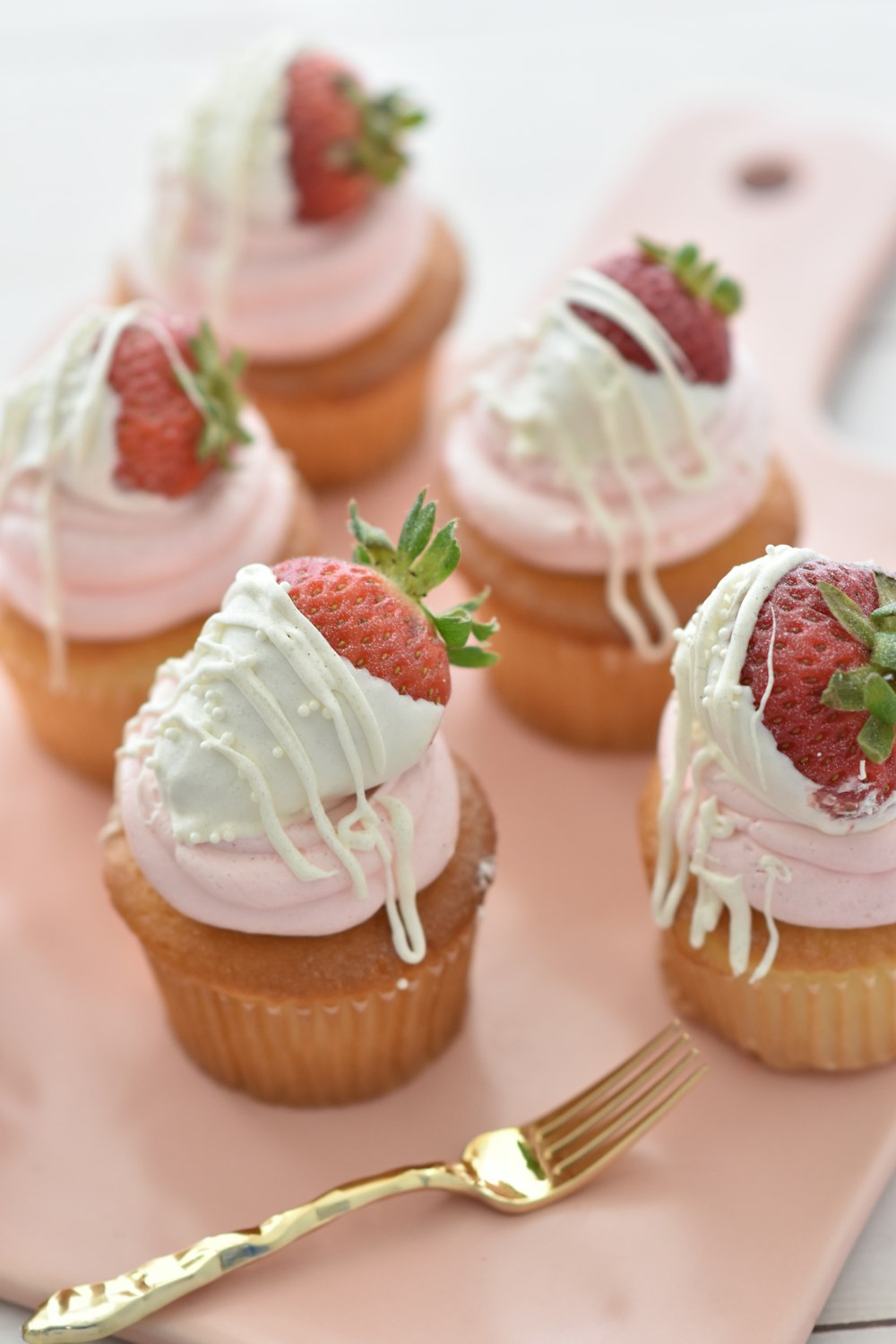 selective focus photography of cupcakes with icings