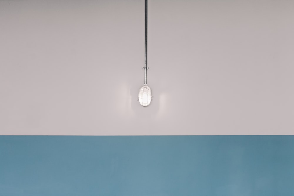 a light bulb hanging from a ceiling in a room