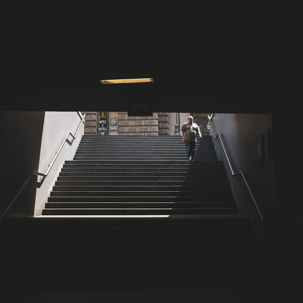 rule of thirds photography unknown person waling on stair