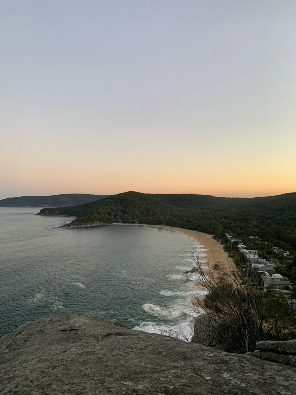 beach across mountains during sunset photo