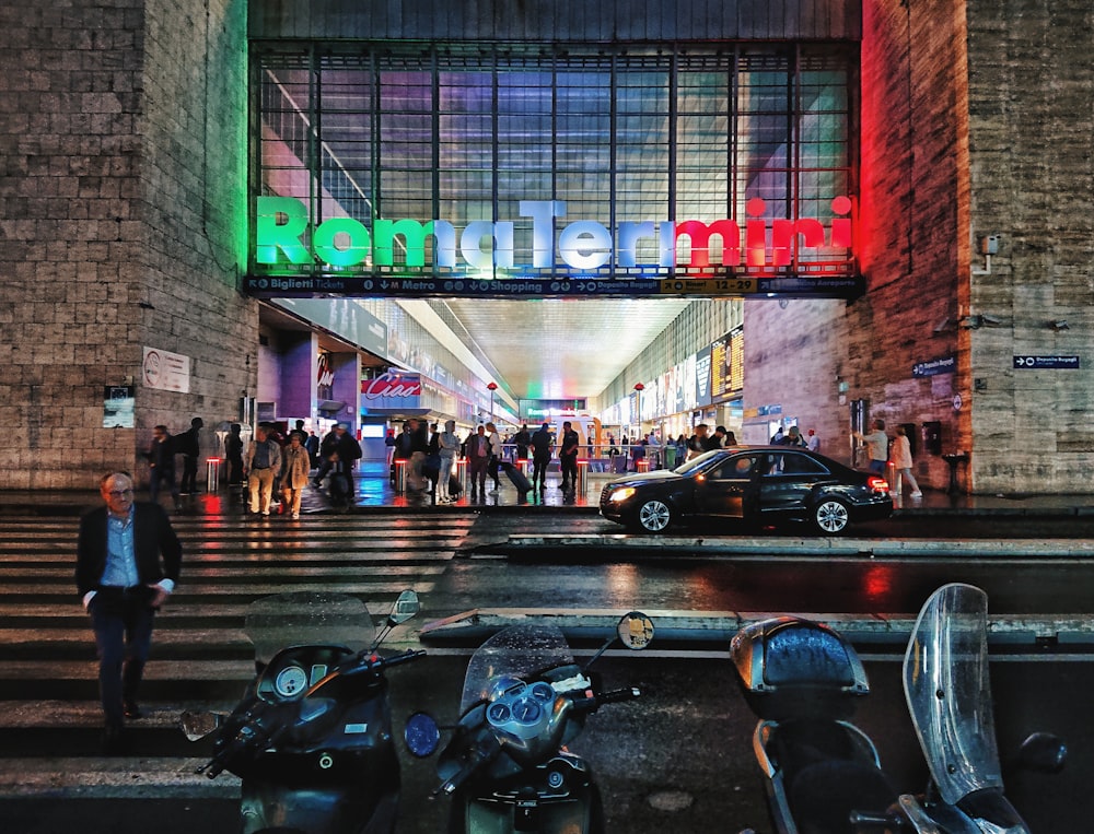 motorcycles across RomaTermiri lighted signage