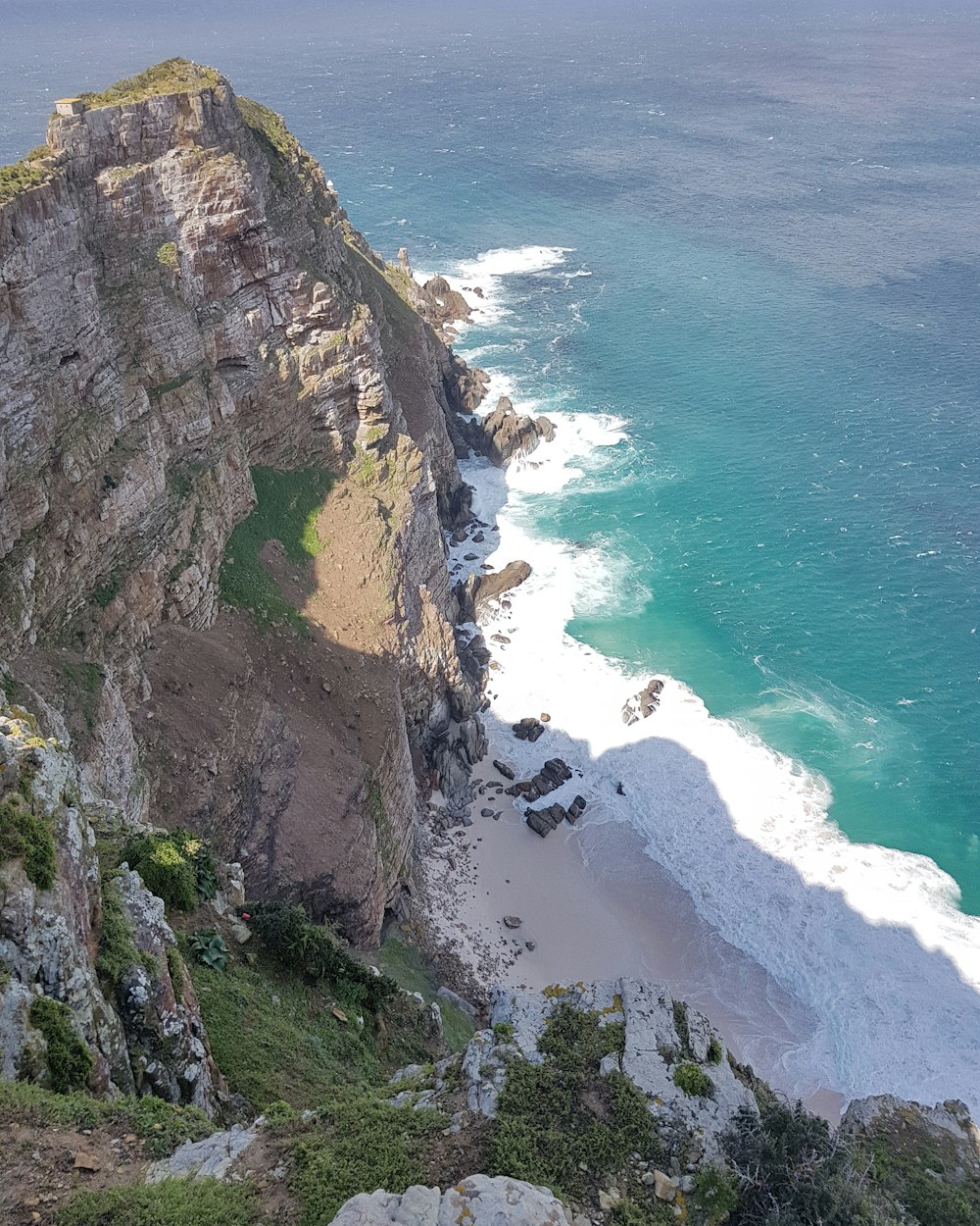 a view of the ocean from the top of a mountain