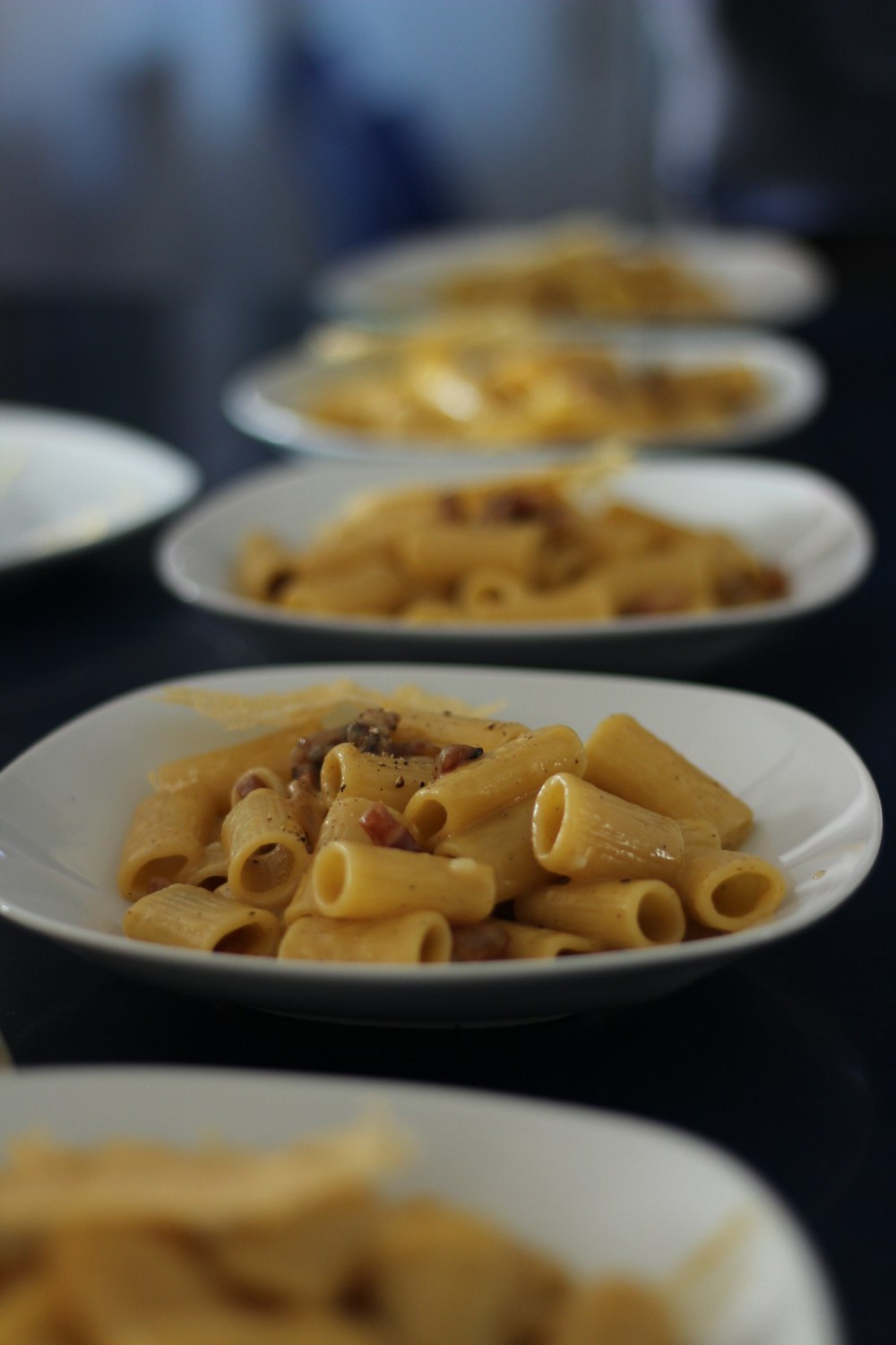macaroni on white plates photo