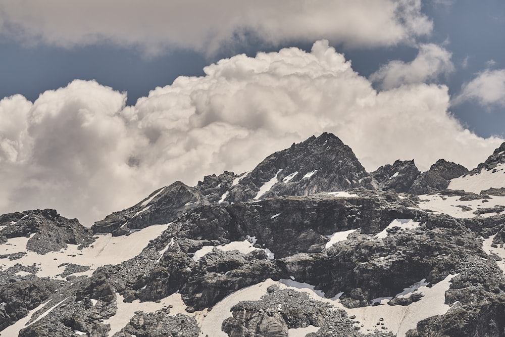 black and white mountain across thick cloud