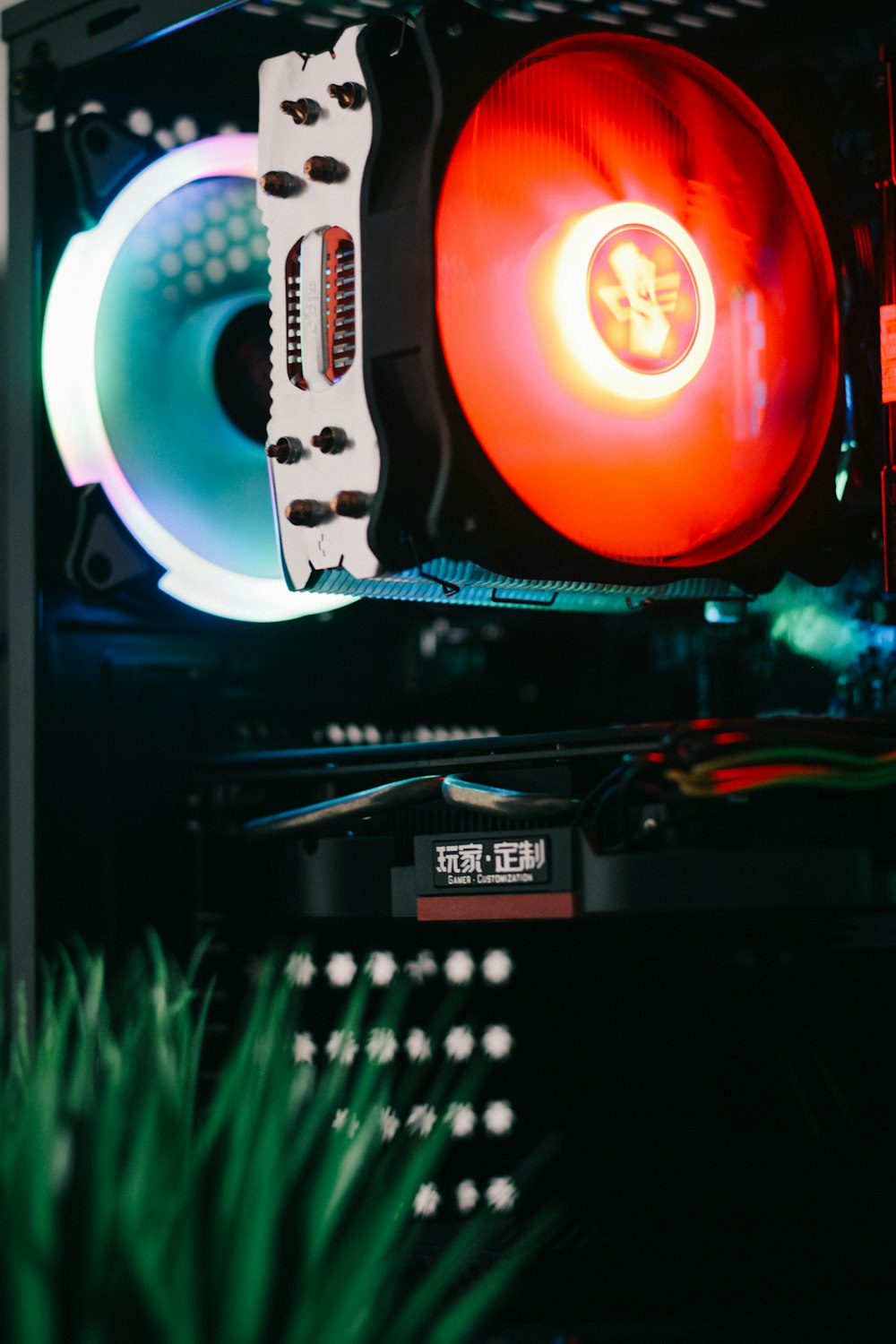 a close up of a computer case with a red fan