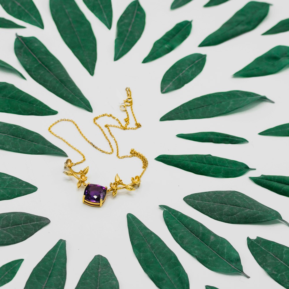 gold-colored purple stone necklace