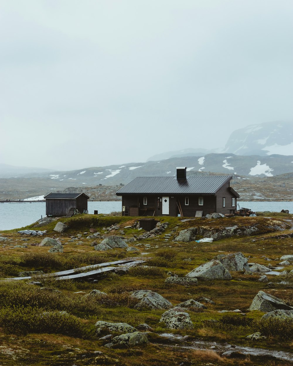 gray house on grass field