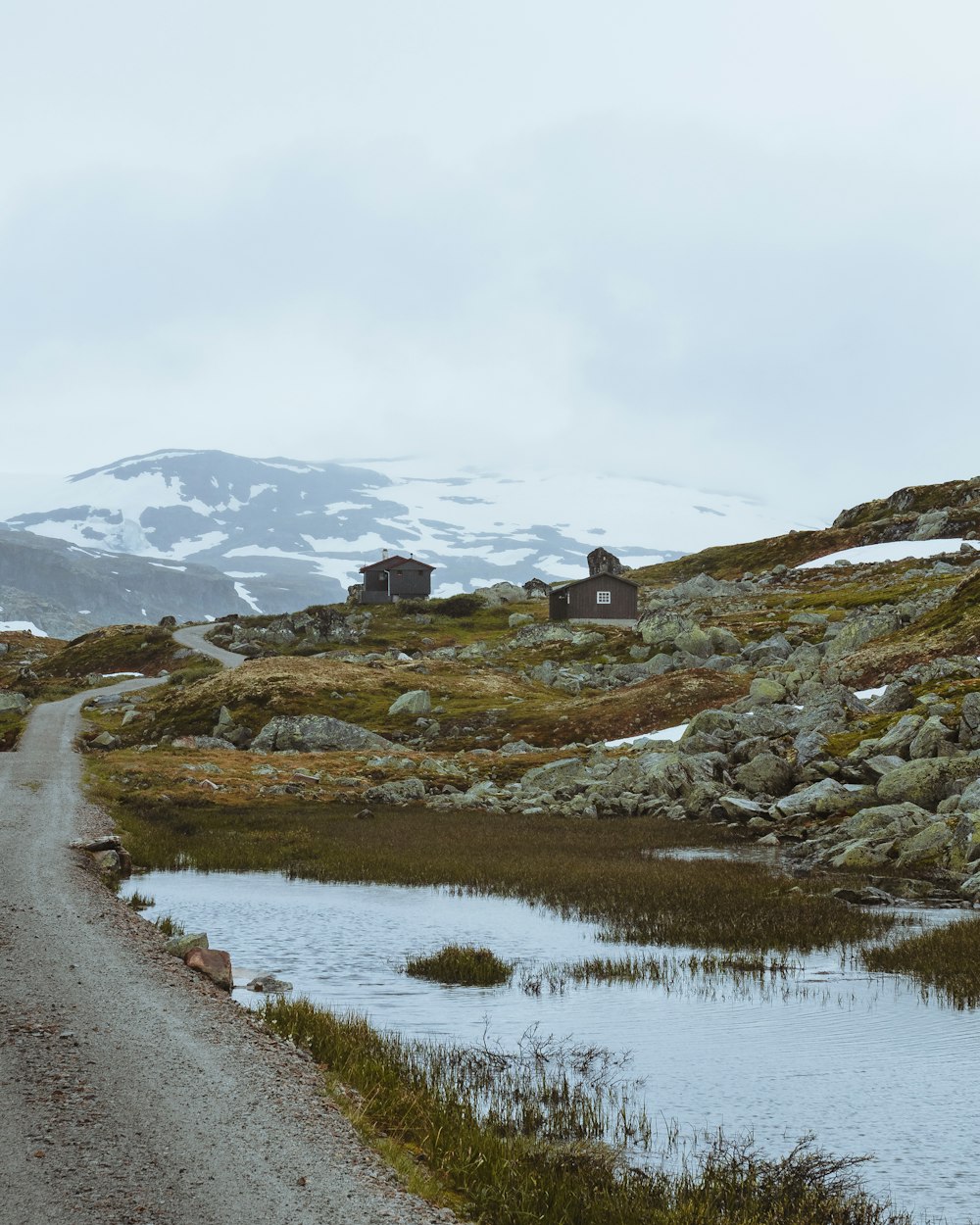 house surrounded by rocks