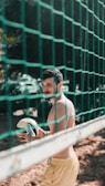 man playing volleyball at daytime