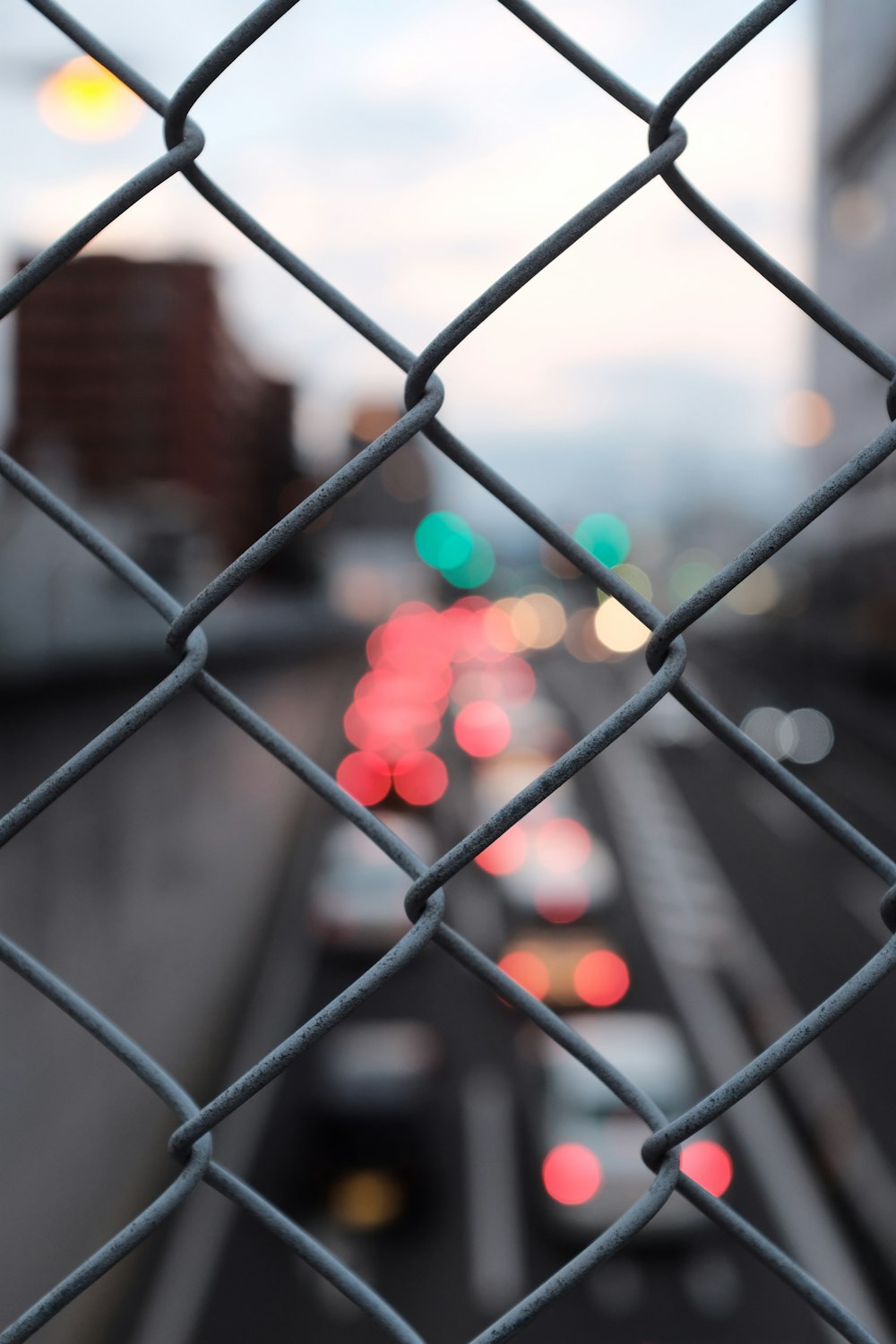 grey chain-link fence bokeh photography