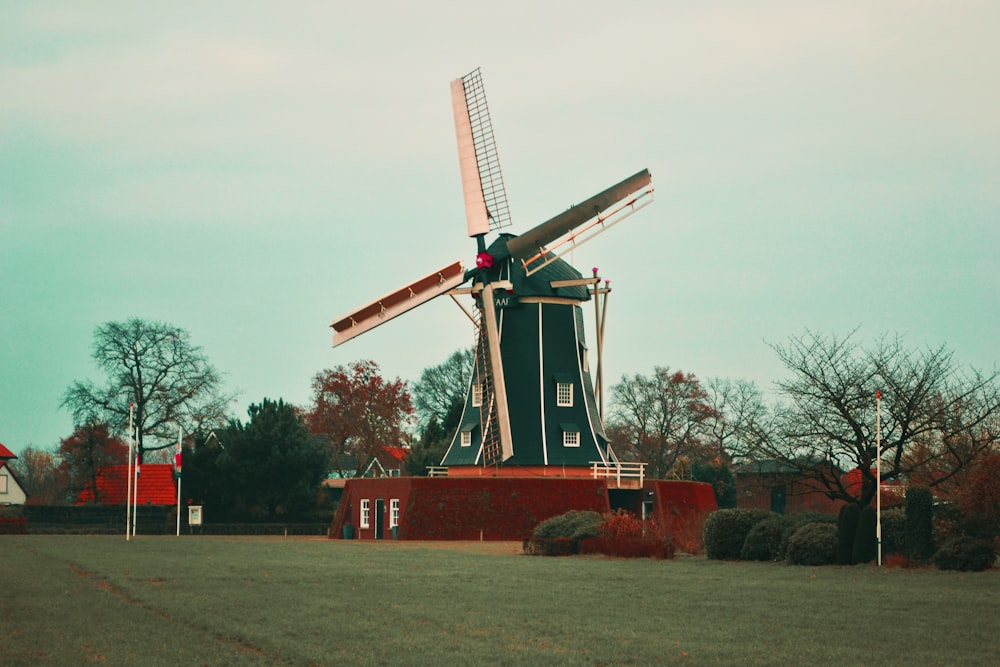 photo of brown and green windmill