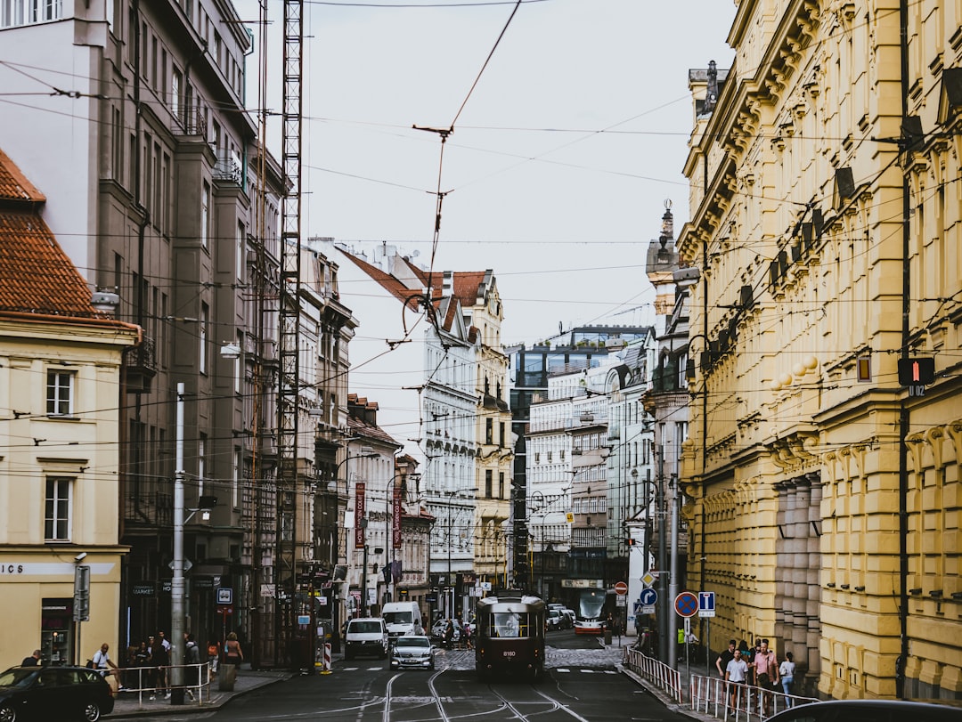 vehicle passing beside buildings,