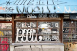 Custom artwork featuring the Squeegenators logo painted on a window, blending art and cleanliness.