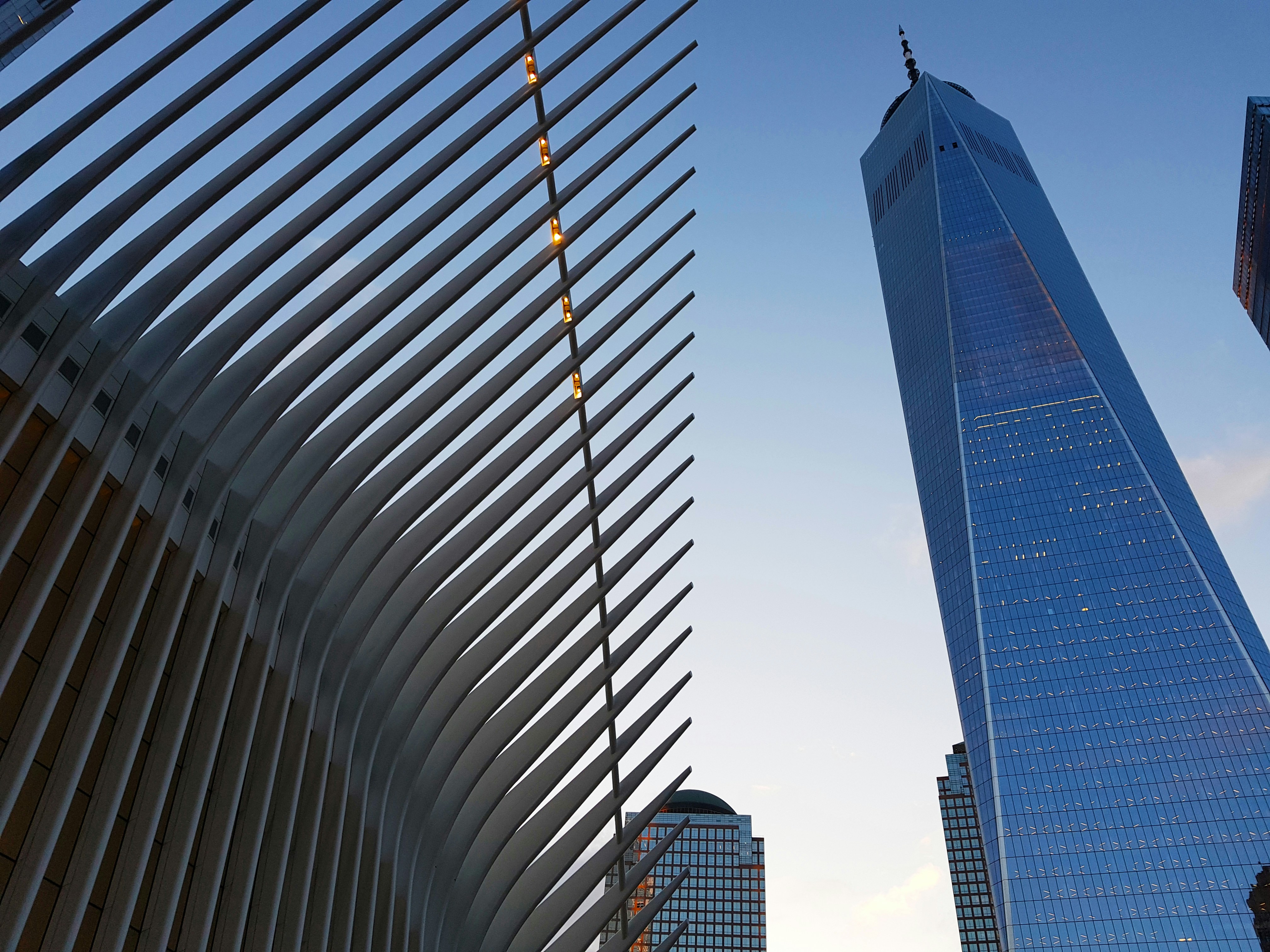 low-angle photography of high-rise glass building