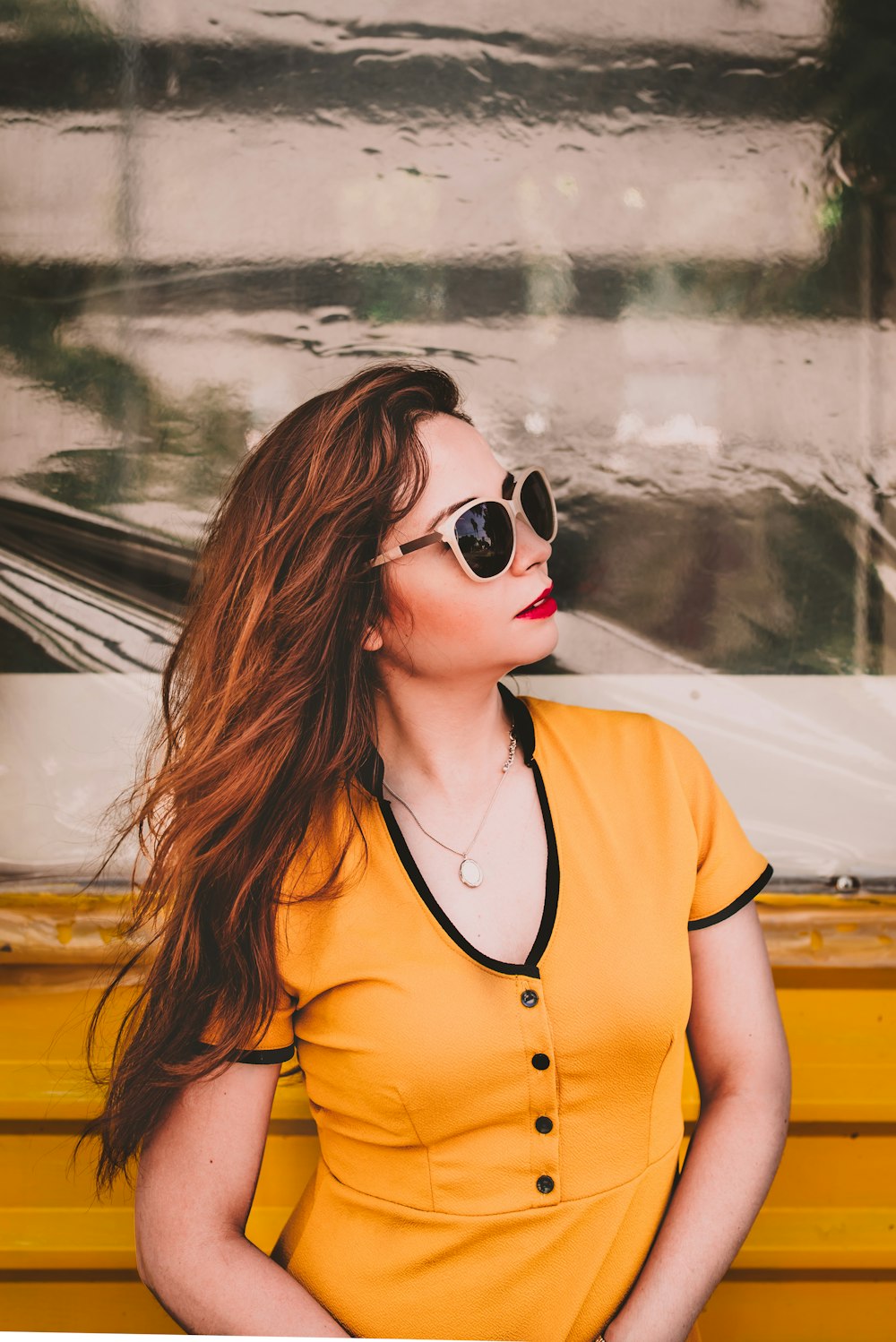 woman in yellow semi-button top